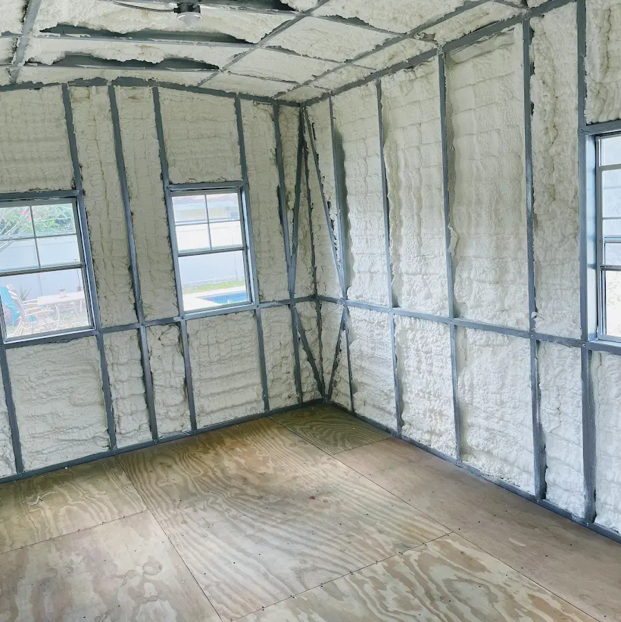 Closed-cell spray foam insulation applied to wall cavities in a residential project in Island Lake
